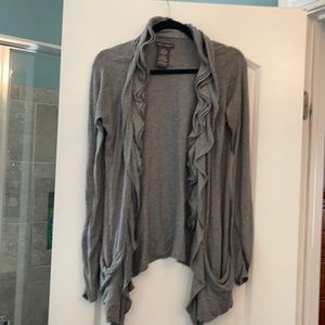 Gray. Longer. Snaps in front.